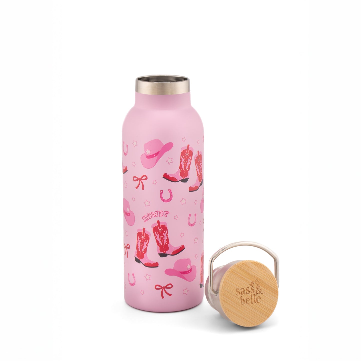 Pink water bottle with cowboy boot and hat design on a white background with bamboo lid next to it.