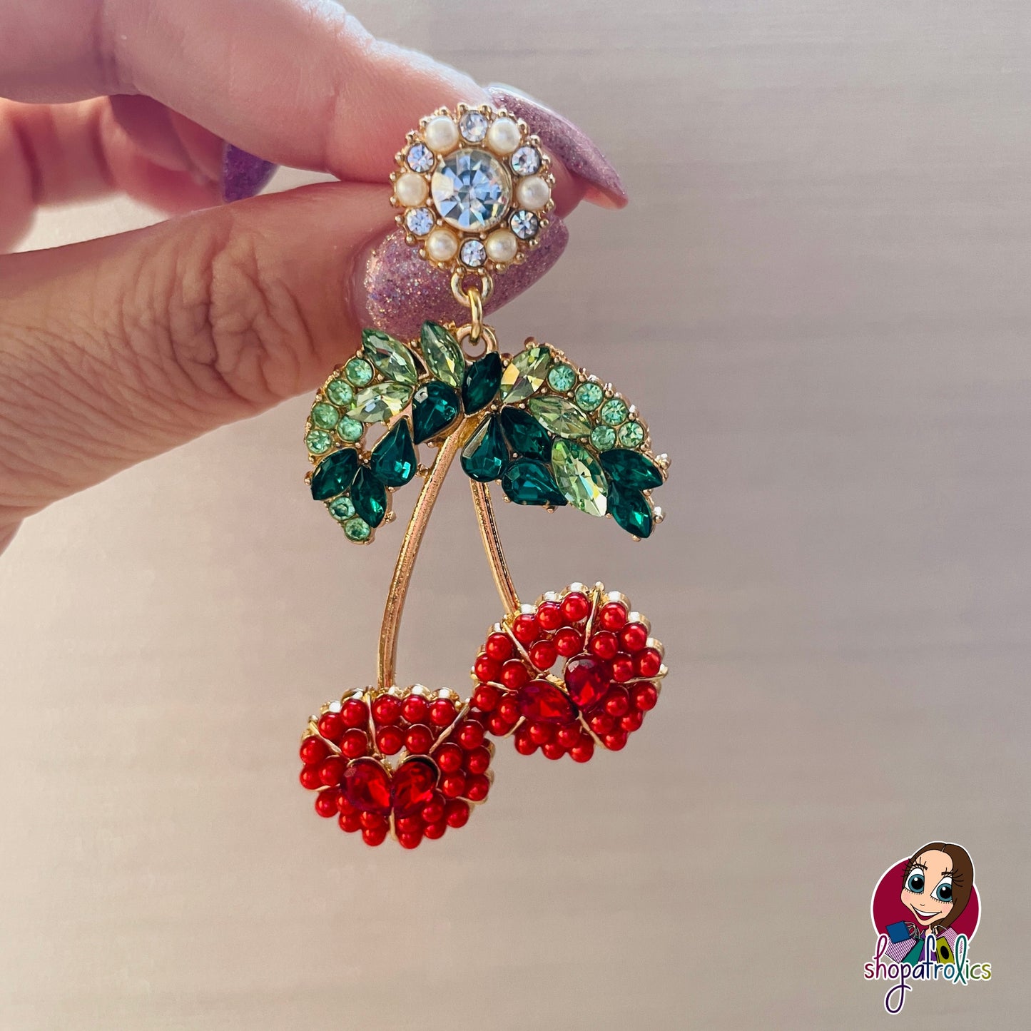 Close up of red cherry large earring