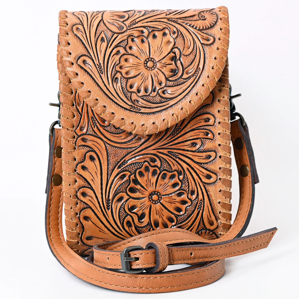 Brown leather crossbody bag with intricate floral patterns on a white background