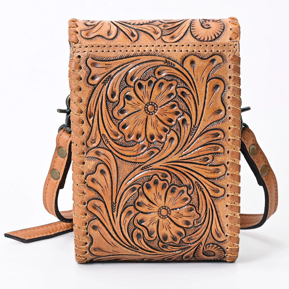 Reverse of brown leather crossbody bag with intricate floral patterns on a white background