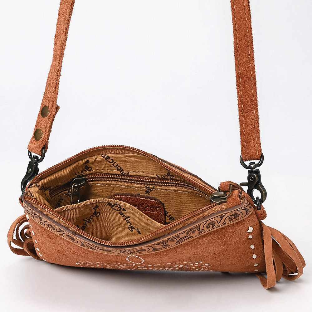 Brown leather crossbody bag with decorative stitching on a white background