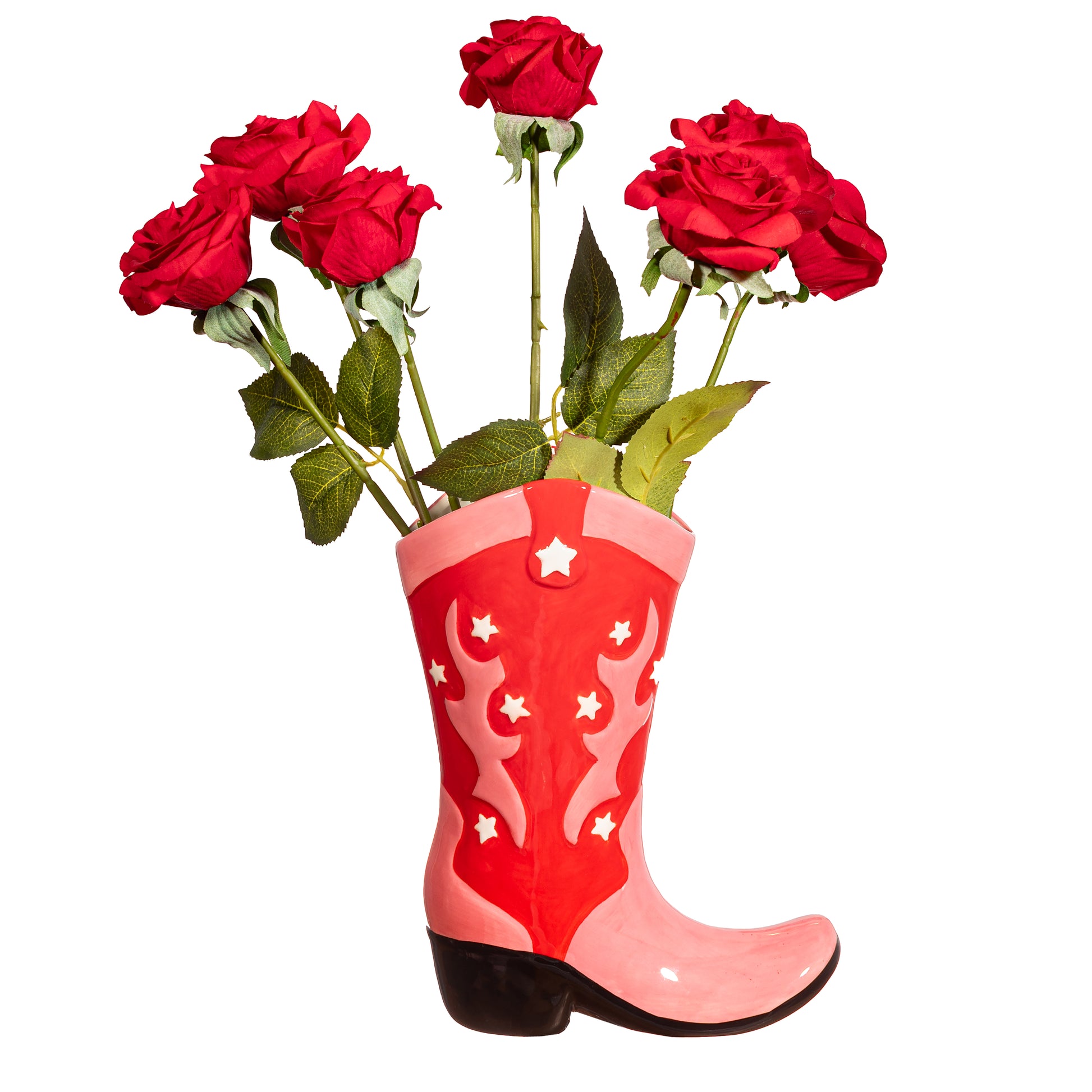 Western cowboy boot vase filled with red roses