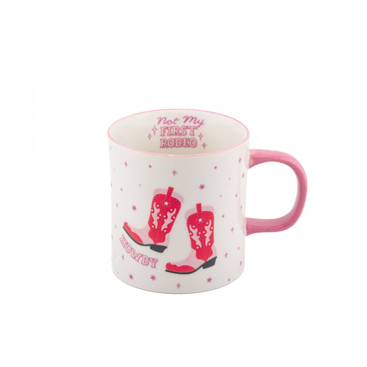 White mug with pink handle and red cowboy boots design on a white background