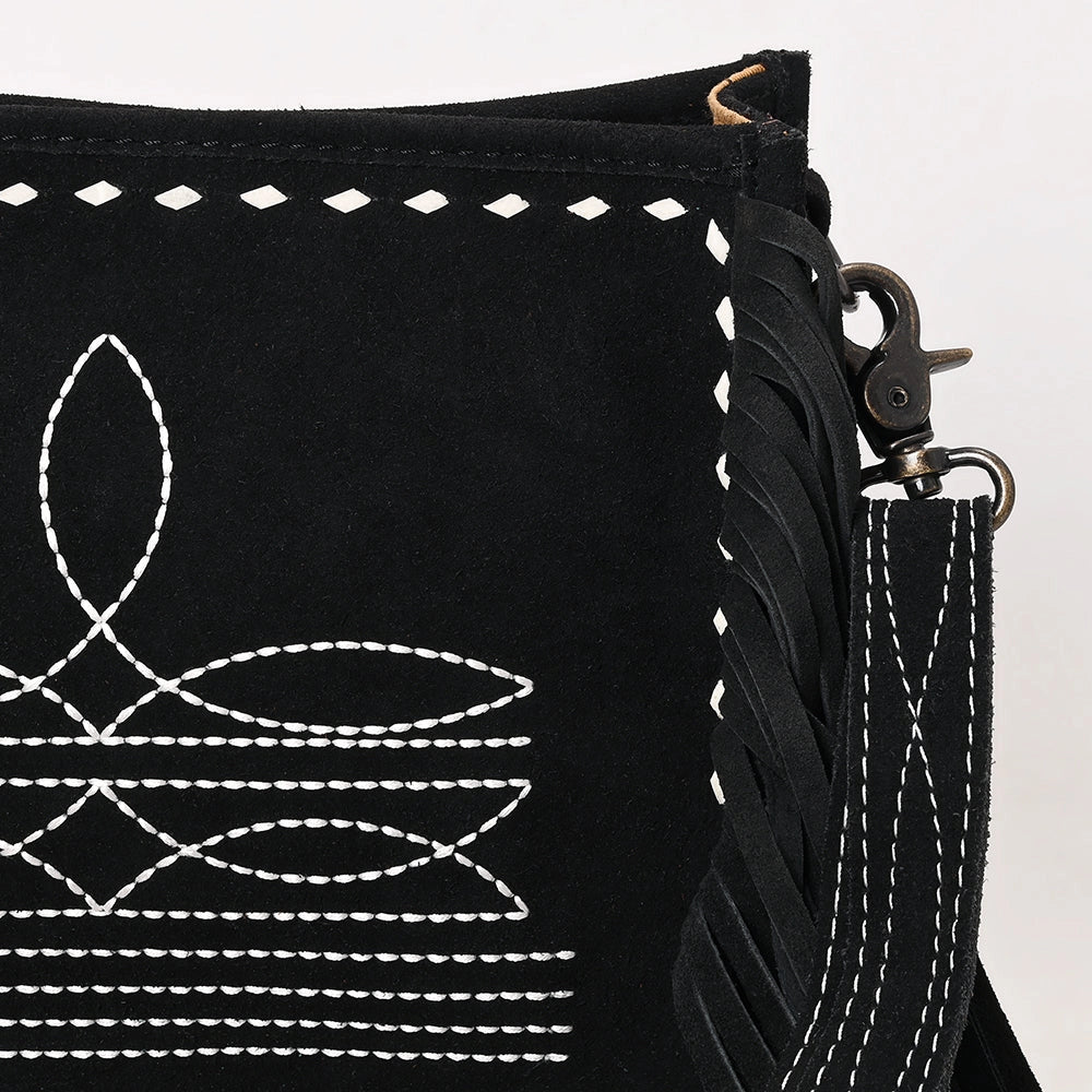 Black bag with white embroidery and a strap on a white background