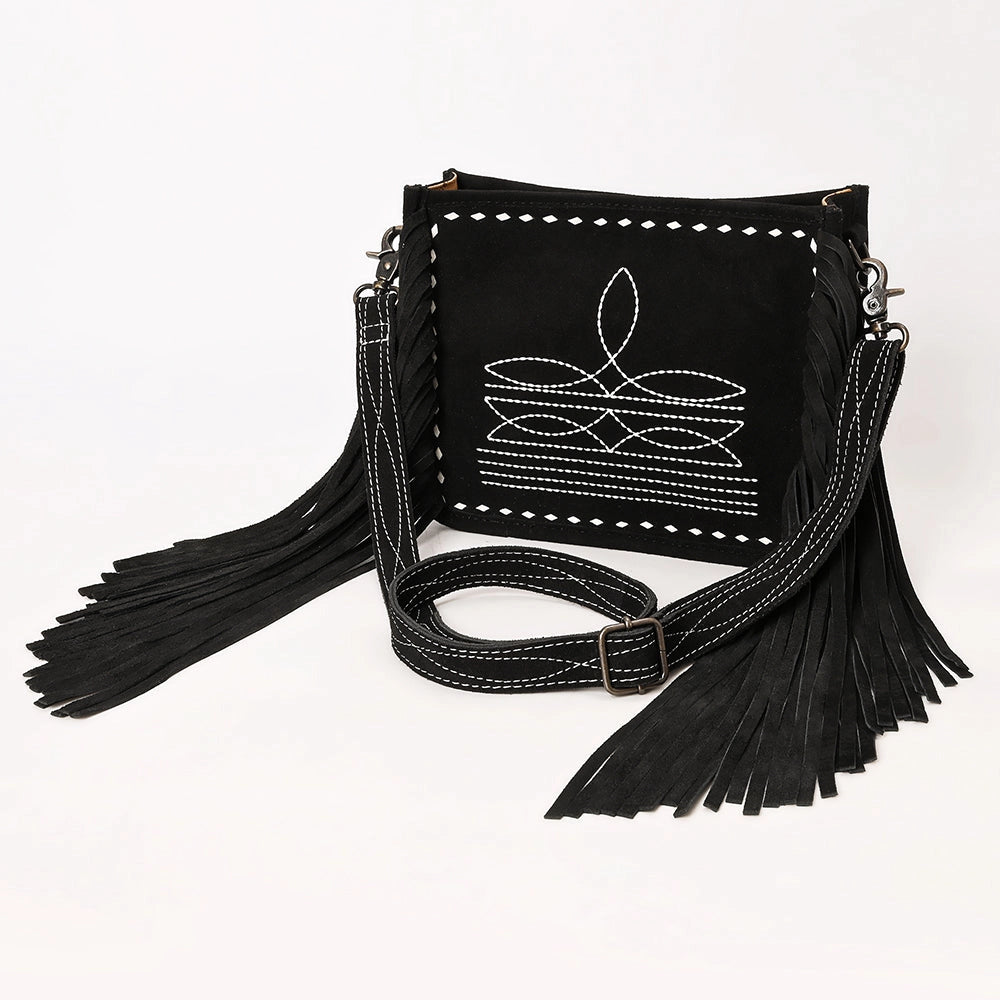 Black handbag with fringe details on a white background