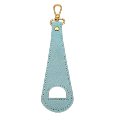 Green leather hat holder bag clip with gold ring on a white background