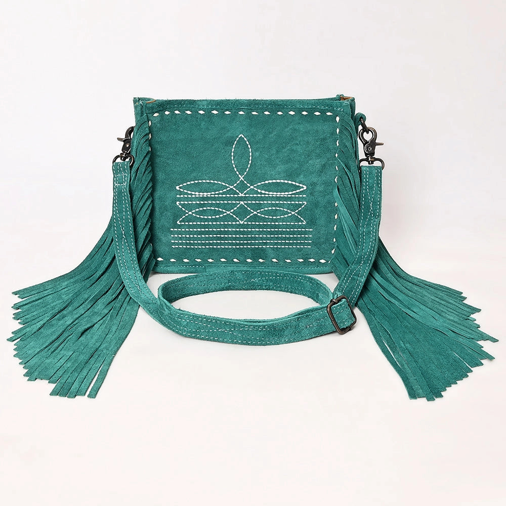 Turquoise handbag with fringe details on a white background