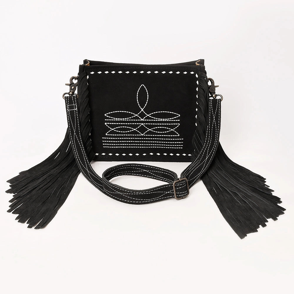 Black handbag with white embroidery and fringes on a white background