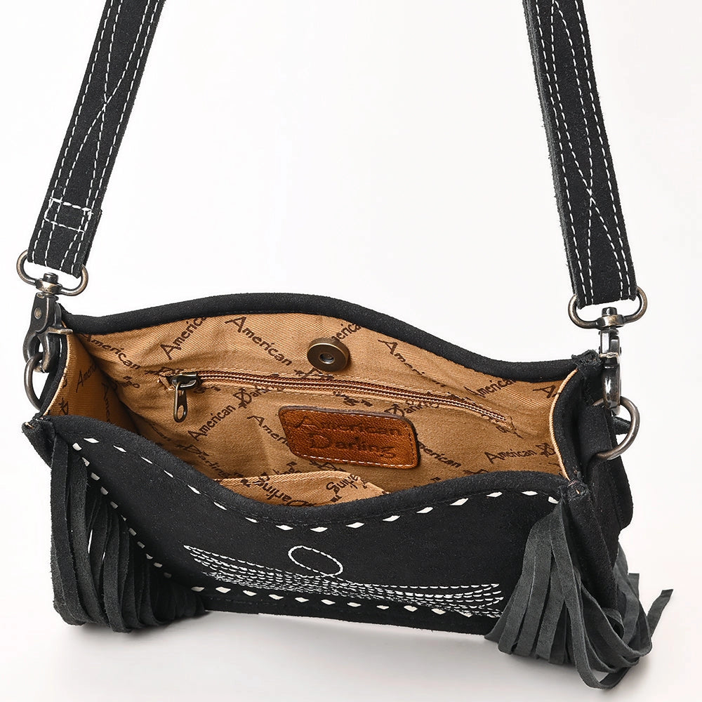 Black handbag with fringe details on a white background
