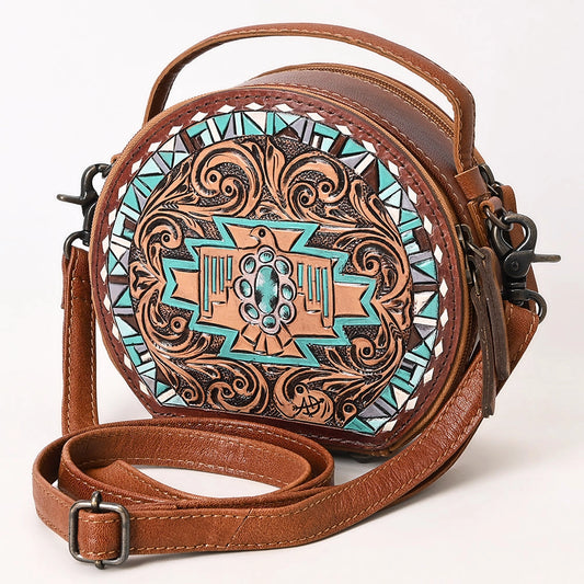 Brown leather crossbody bag with intricate turquoise and gold design on a white background