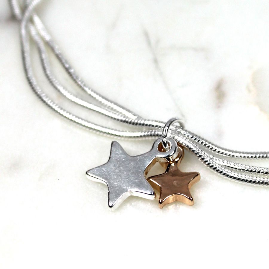 Silver plated triple chain bracelet with a silver plated star and a rose gold plated star