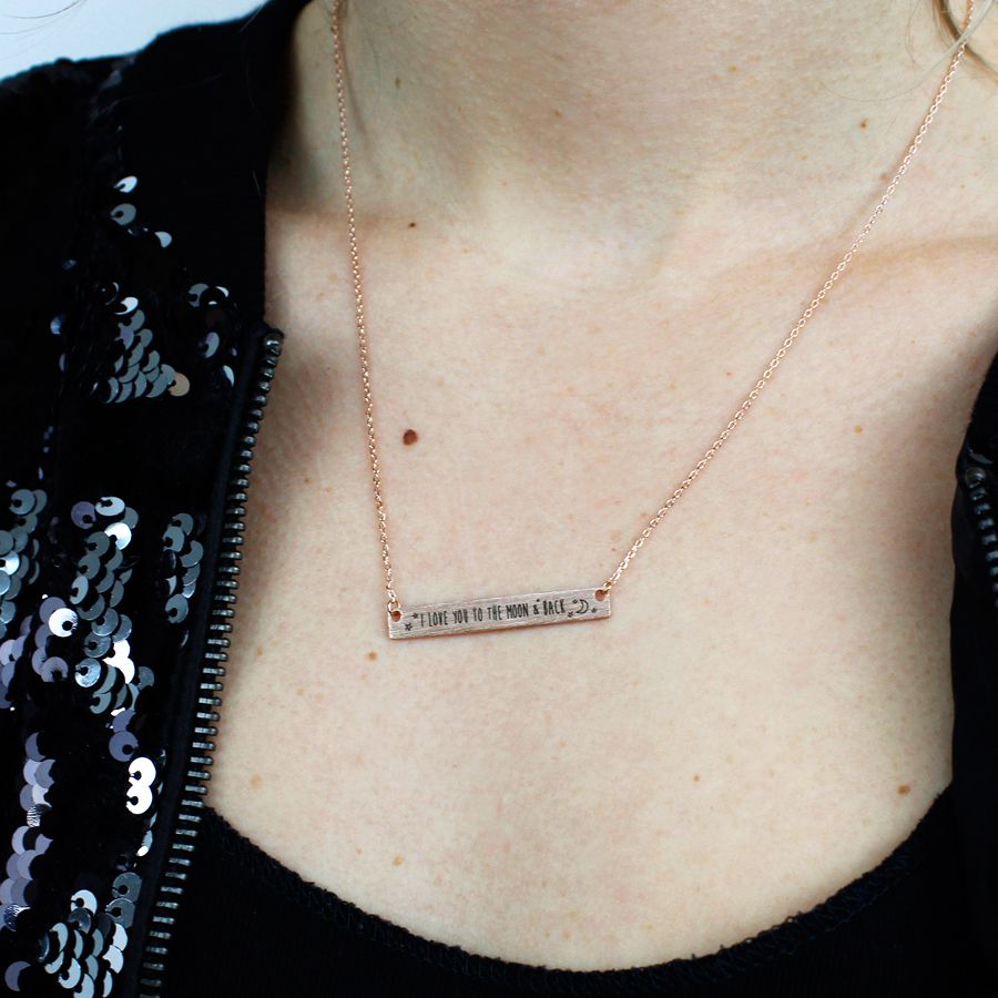 Fine chain necklace in a rose gold style finish with a brushed rose gold plated bar featuring the engraved message 'I love you to the moon and back' and little moon and stars