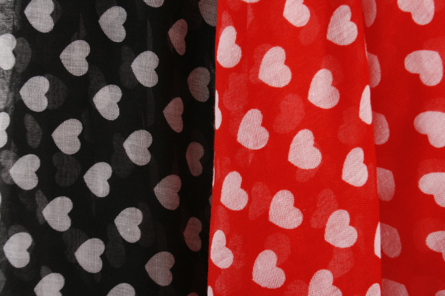 Pretty heart print scarf in a choice of red or black. 