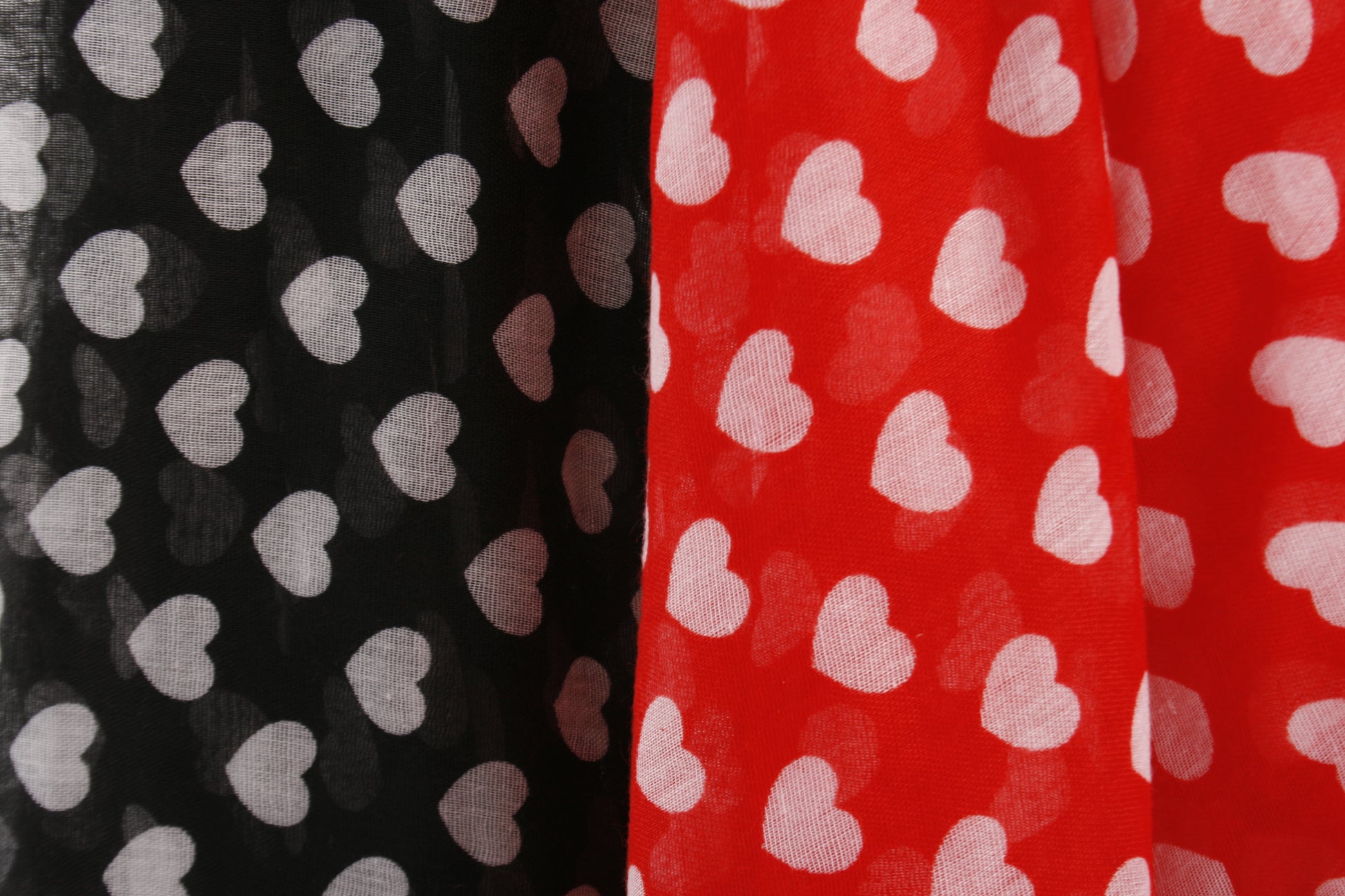 Pretty heart print scarf in a choice of red or black. 