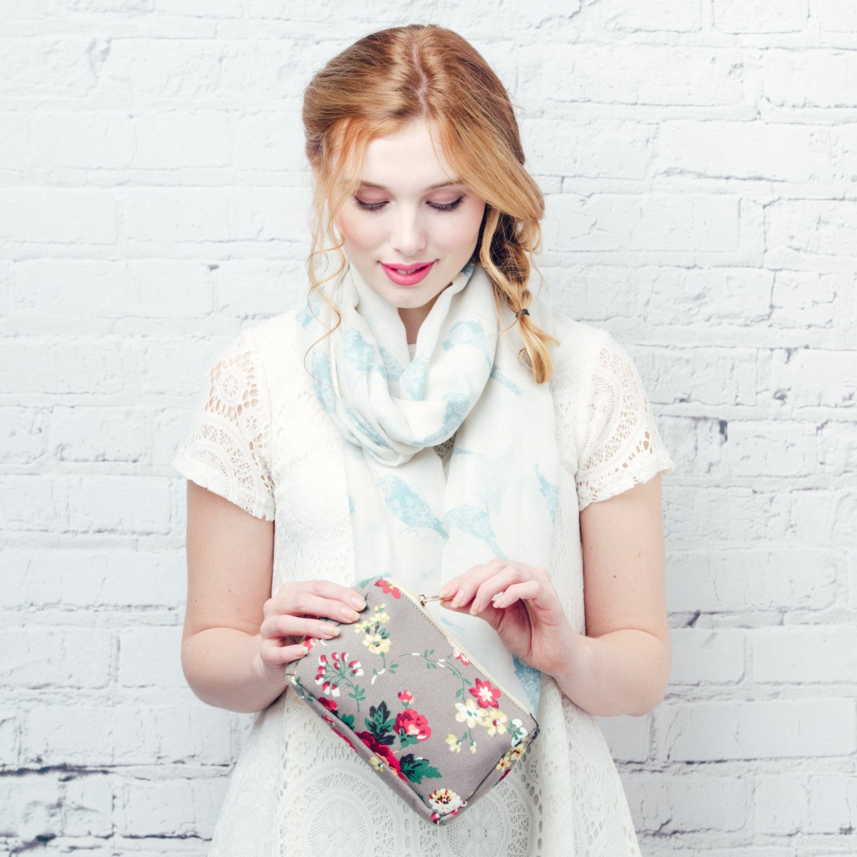 Vintage rose floral design make up bag on a grey background