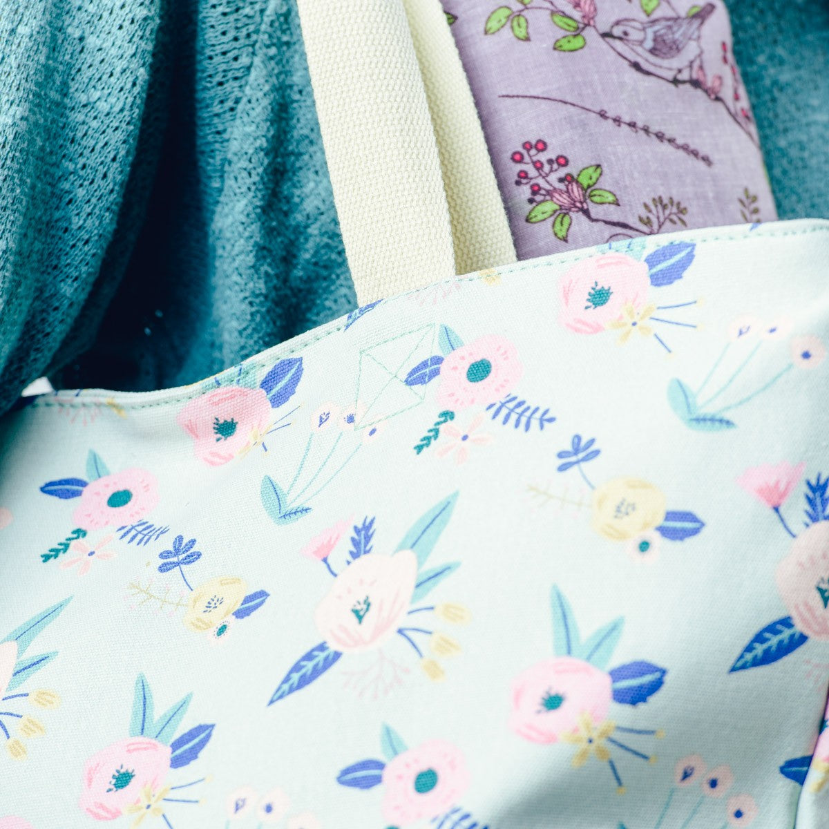 Close up of large fun pastel green floral print canvas bag