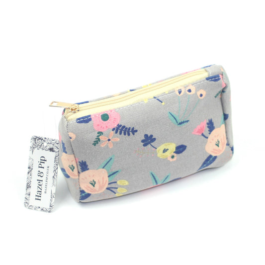 Grey pastel floral print design make up bag.