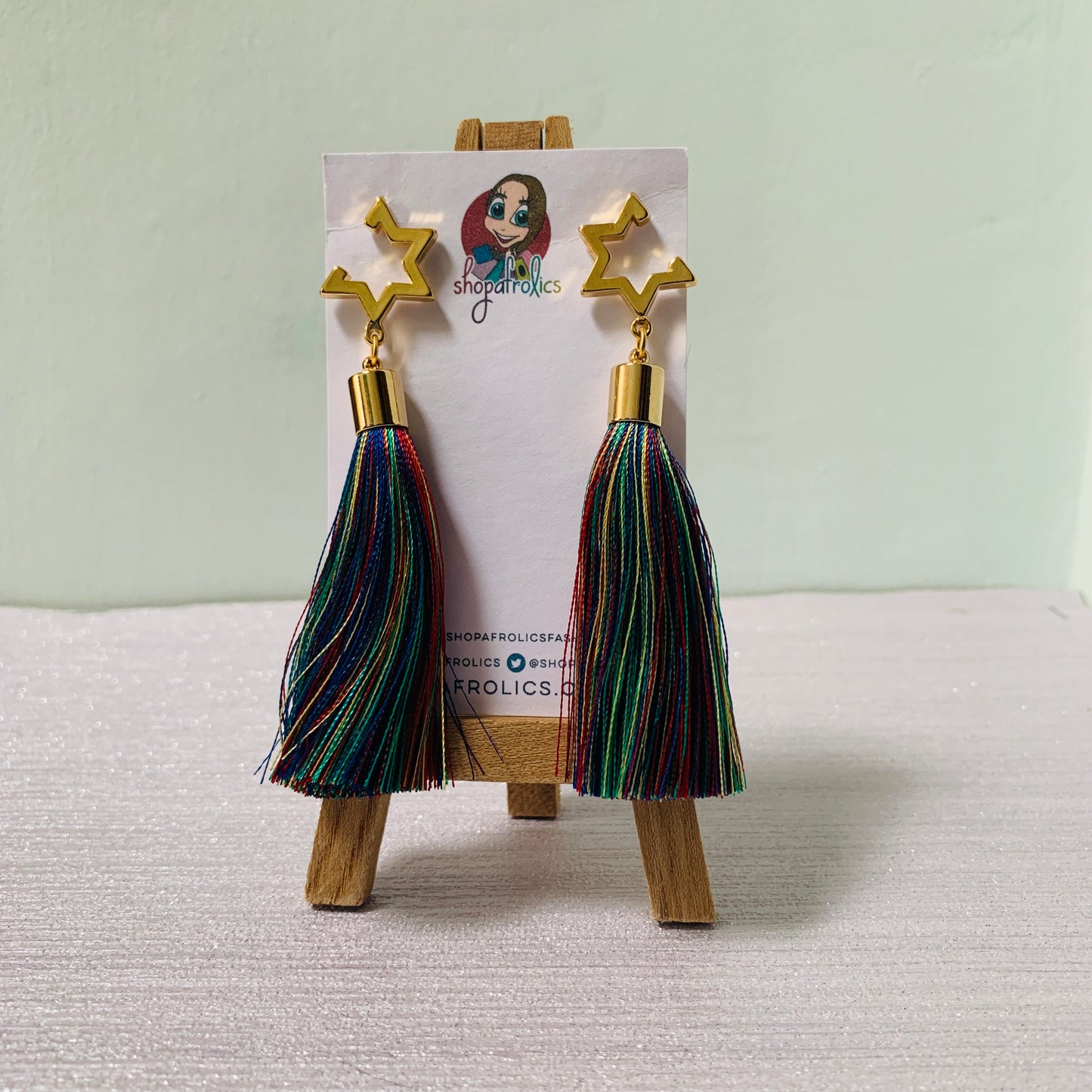 Open star and vibrant rainbow tassel earrings