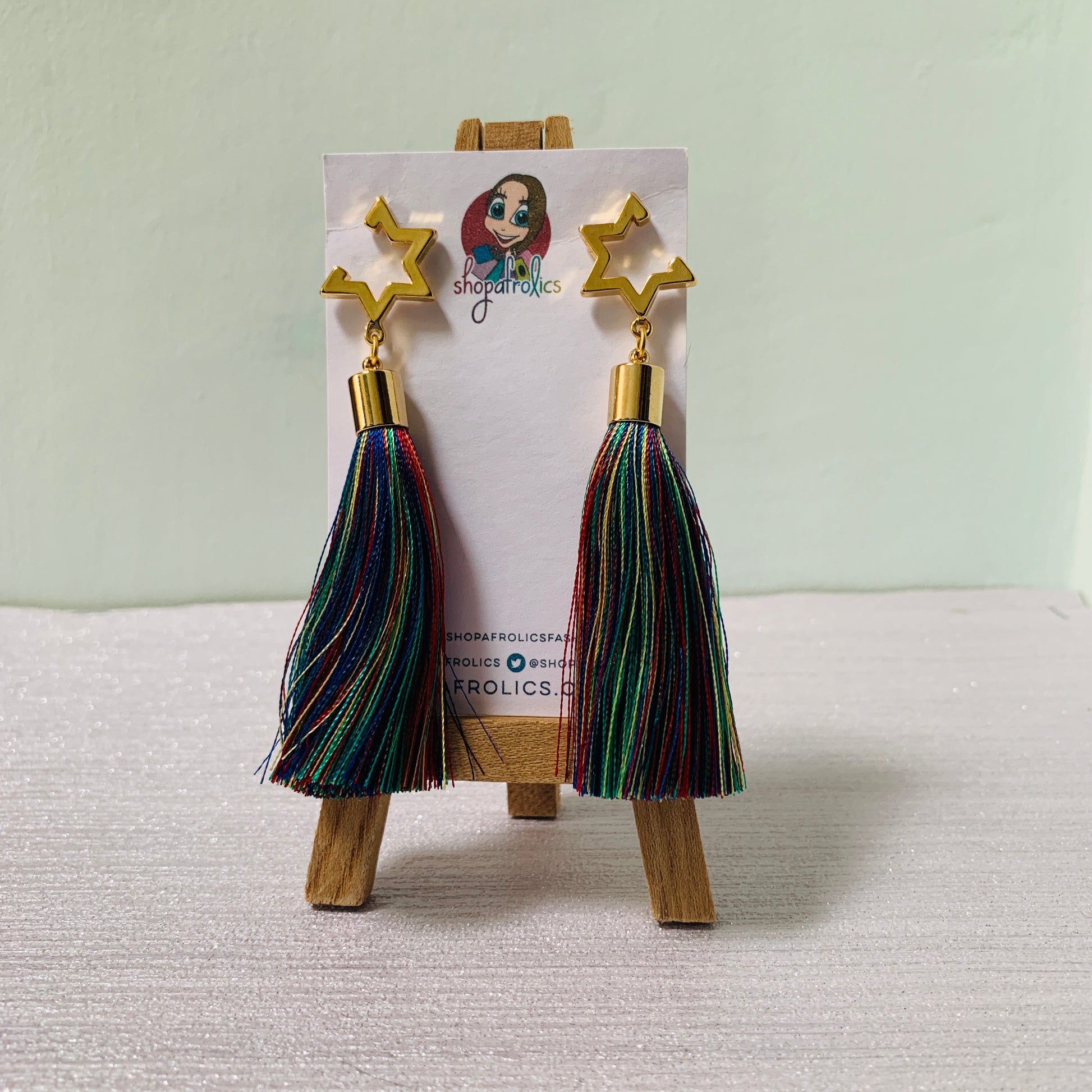 Open star and vibrant rainbow tassel earrings