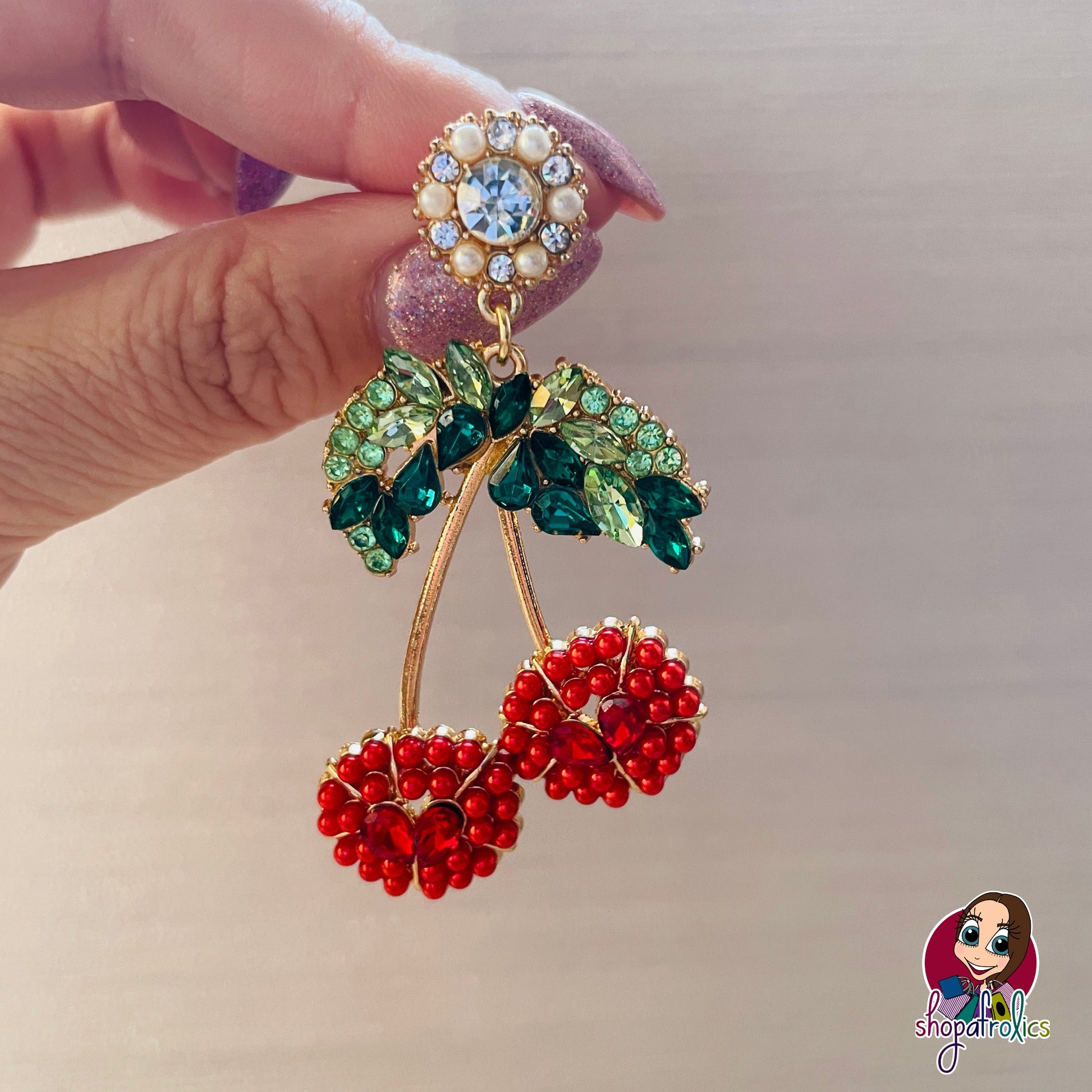 Close up of red cherry large earring