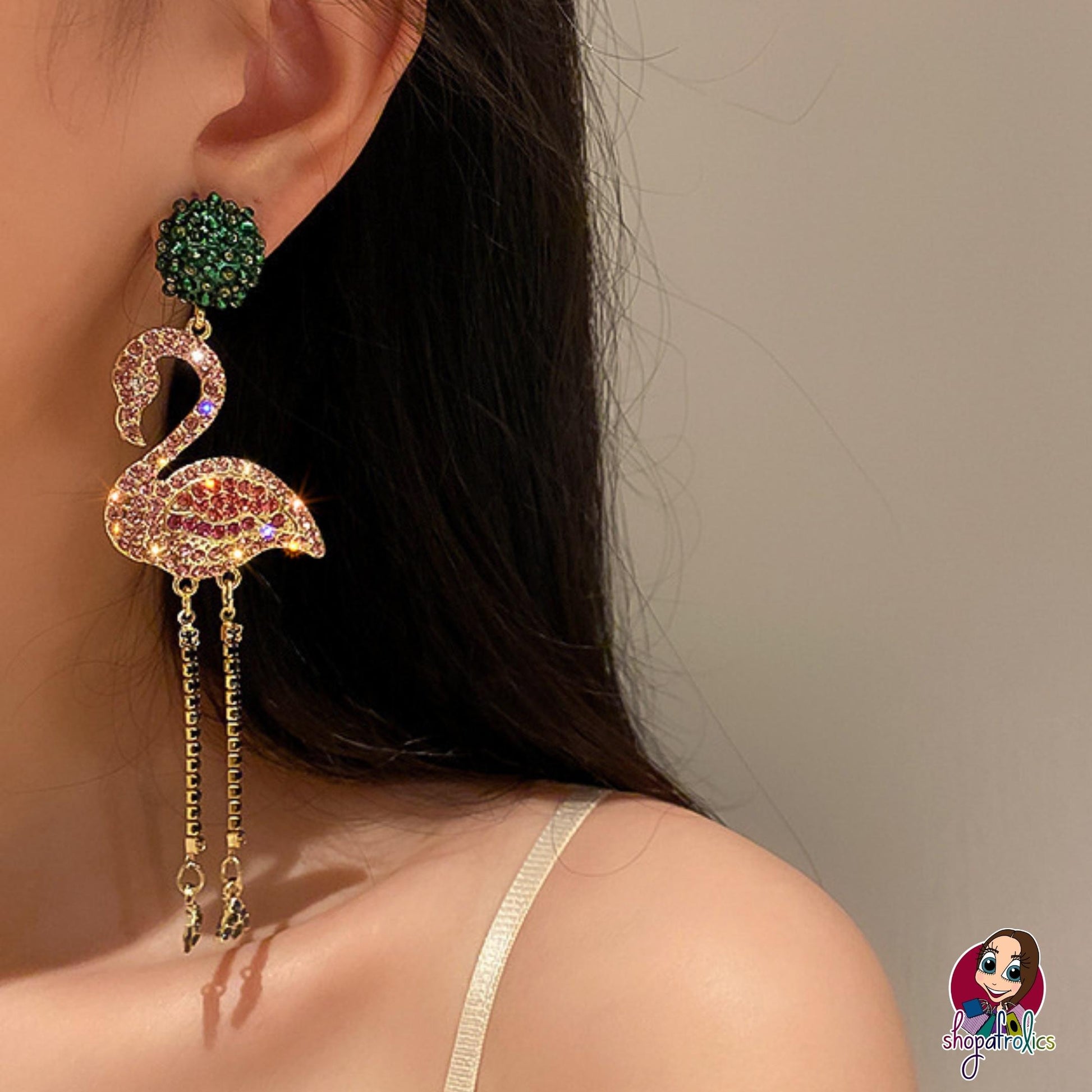  pink crystal flamingo earrings modelled in ear