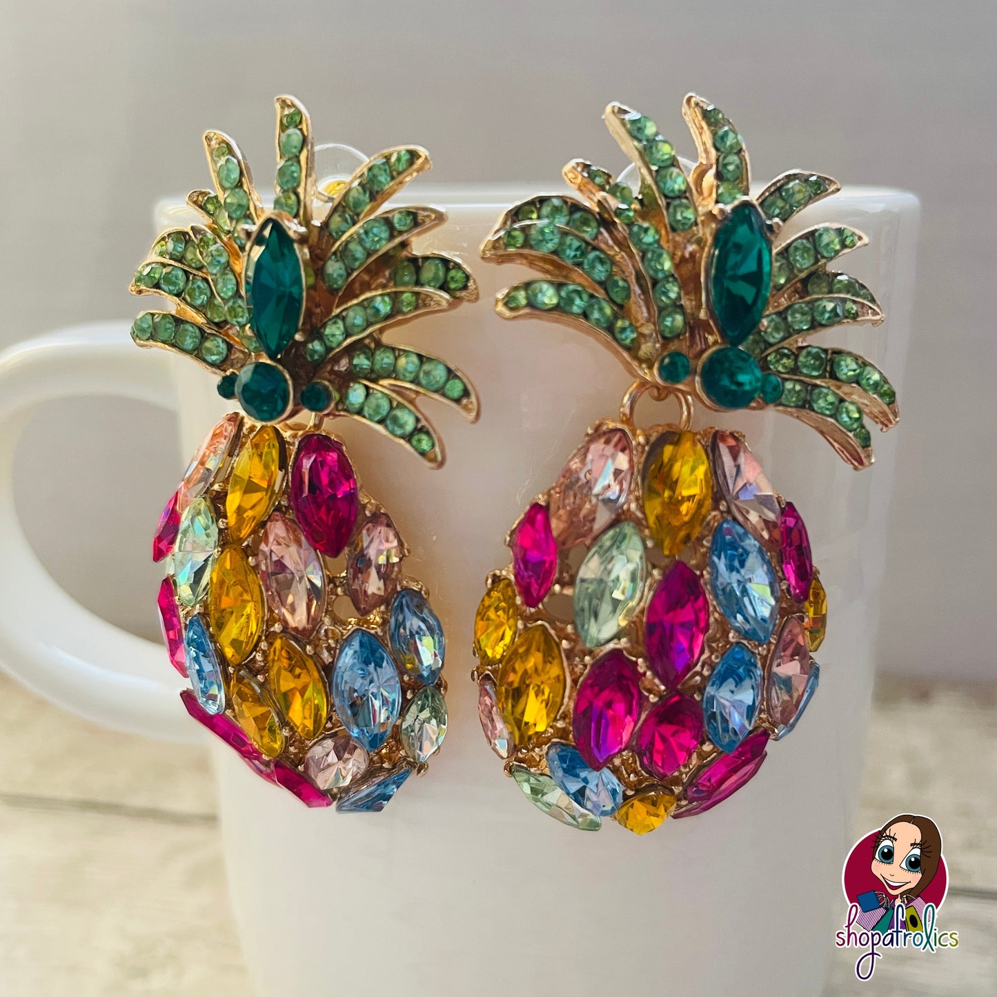 Close up of large pineapple crystal earrings