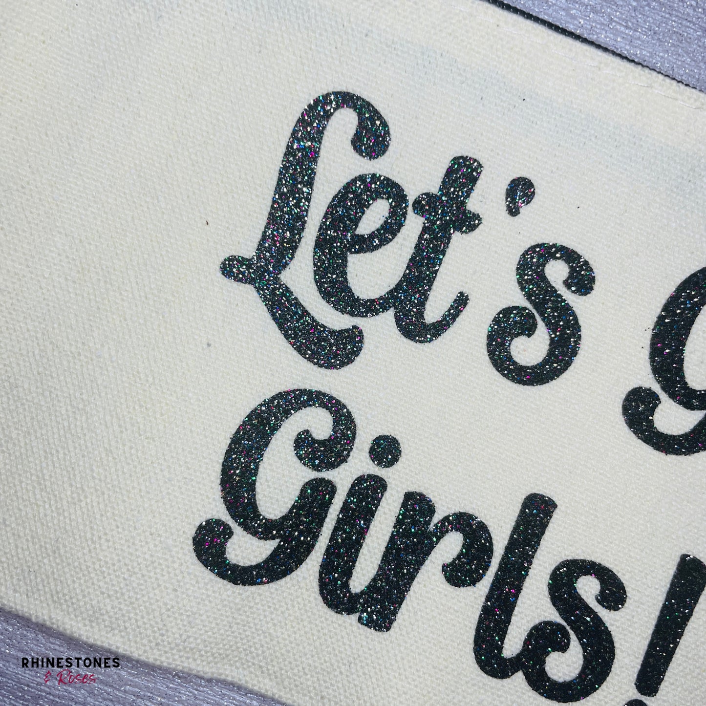 Close up glitter vinyl on Let's Go Girls Make Up Bag