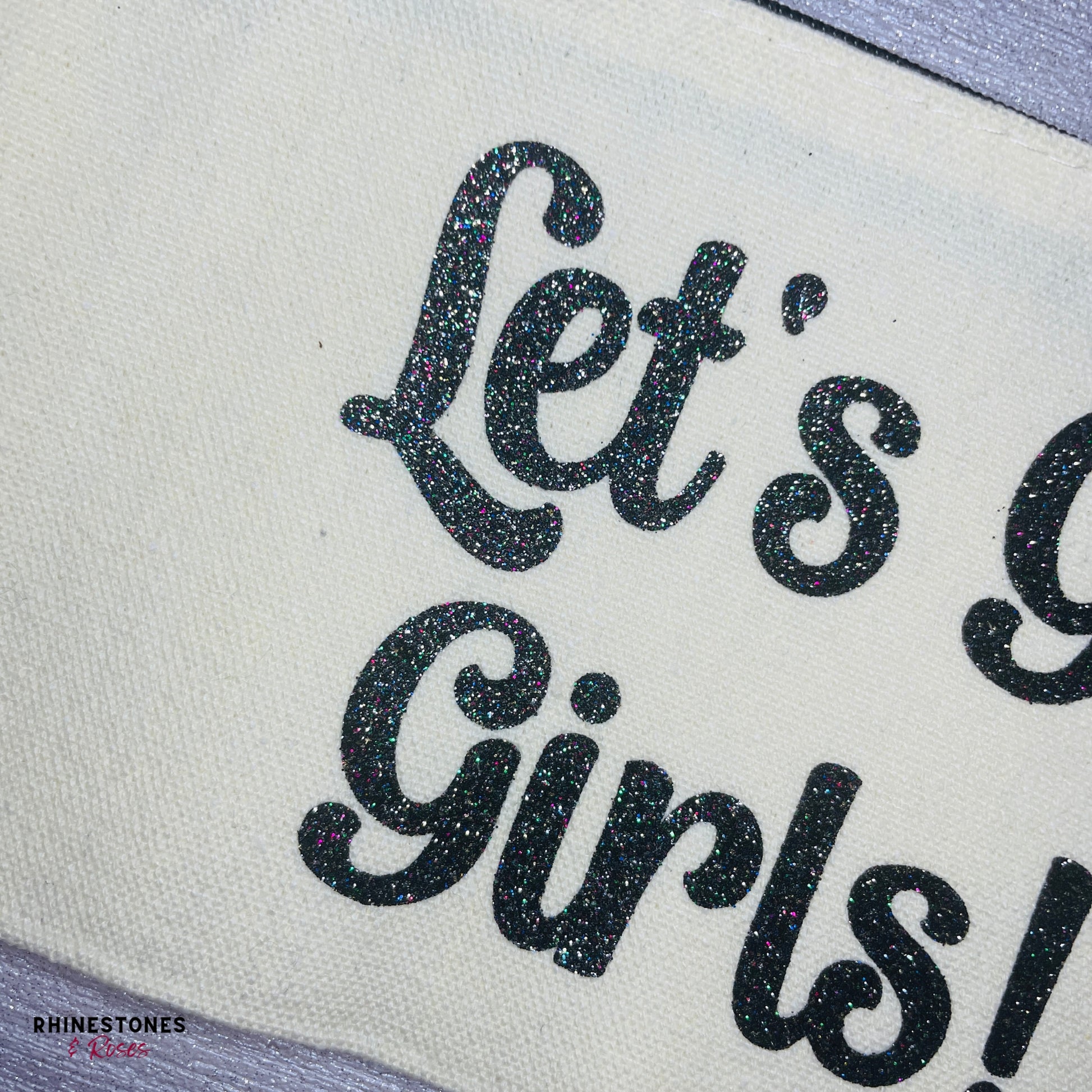 Close up glitter vinyl on Let's Go Girls Make Up Bag