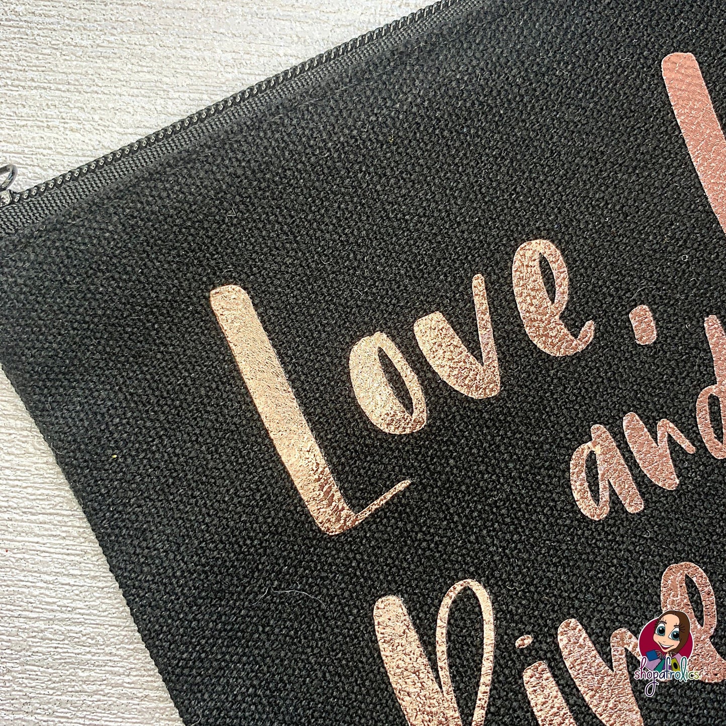 Close up of lettering on pineapple cosmetic bag