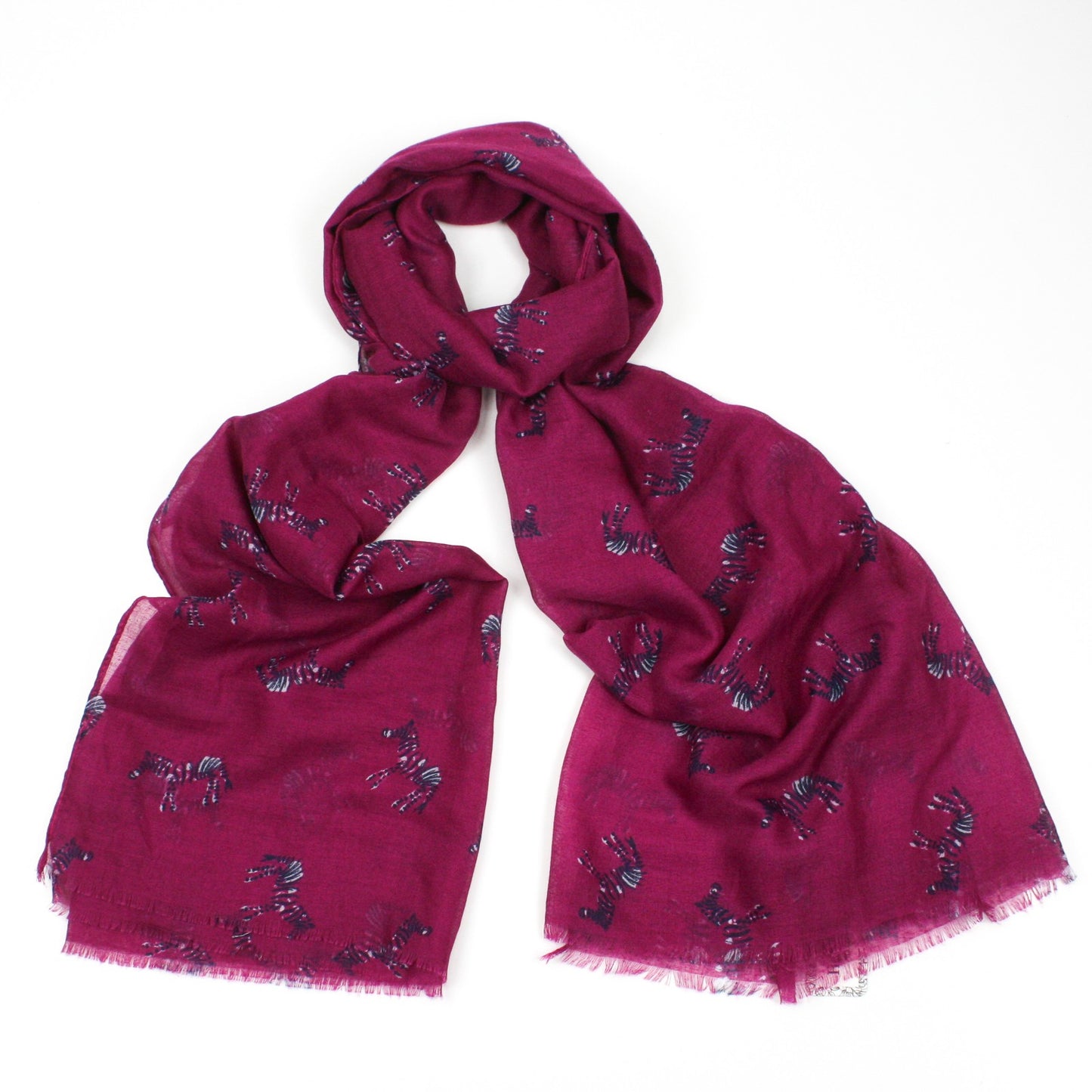 Zebra print on a dark pink background with feathered edge 