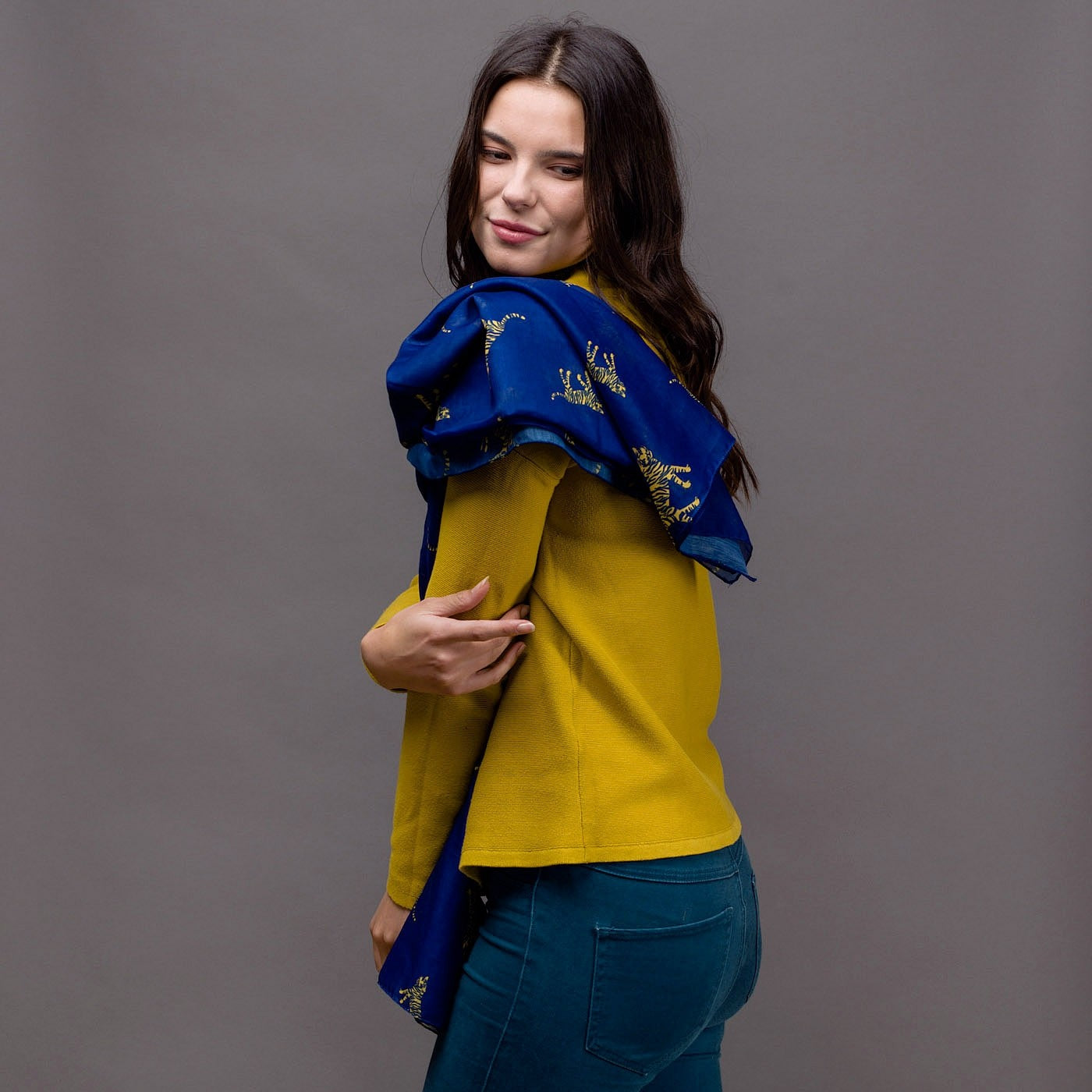 Tiger print on a royal blue background with a rolled edge. 