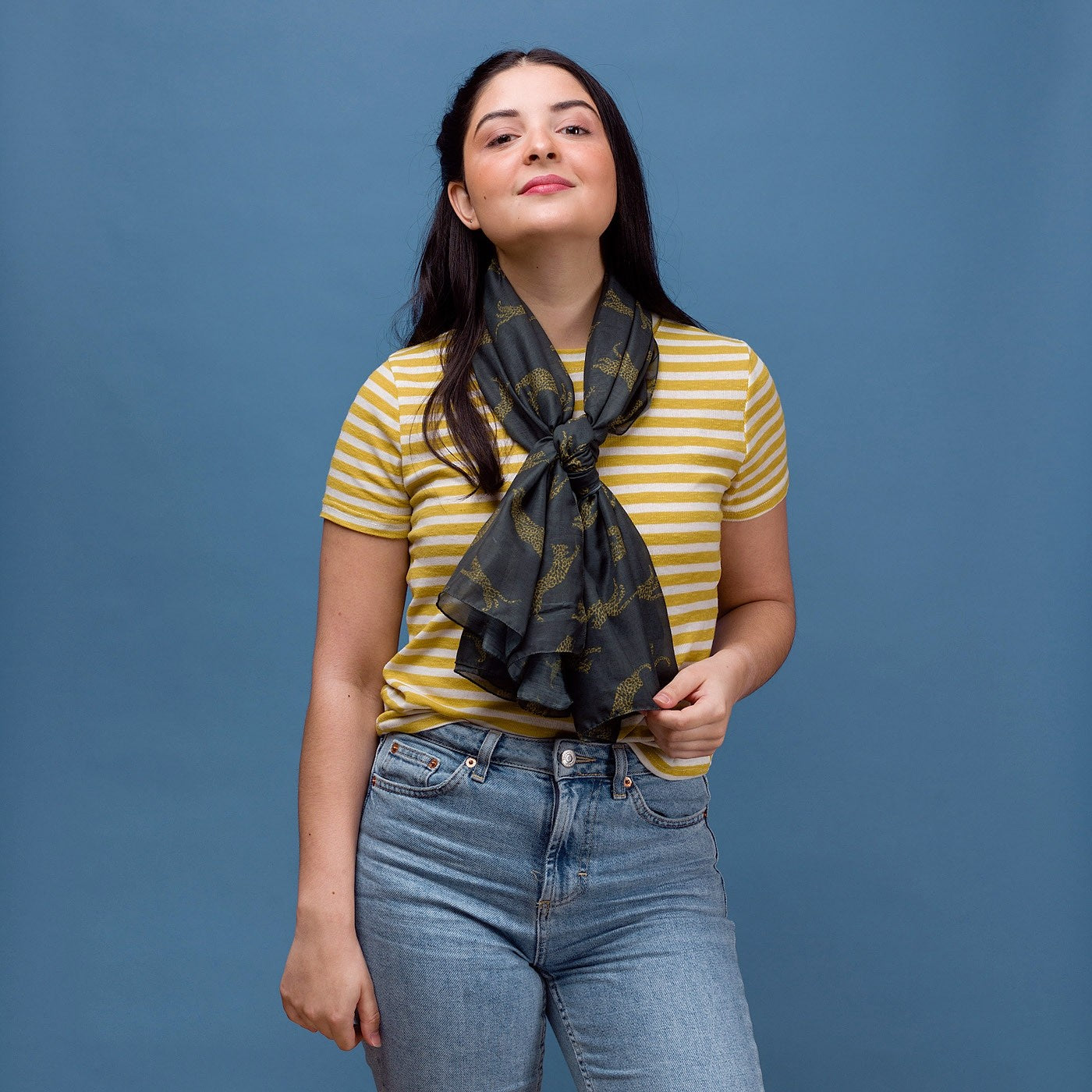 Leopard print on a dark grey background with a rolled edge. 