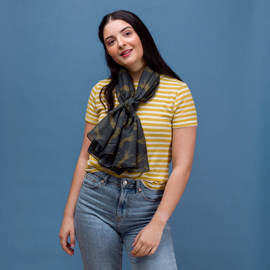 Leopard print on a dark grey background with a rolled edge. 