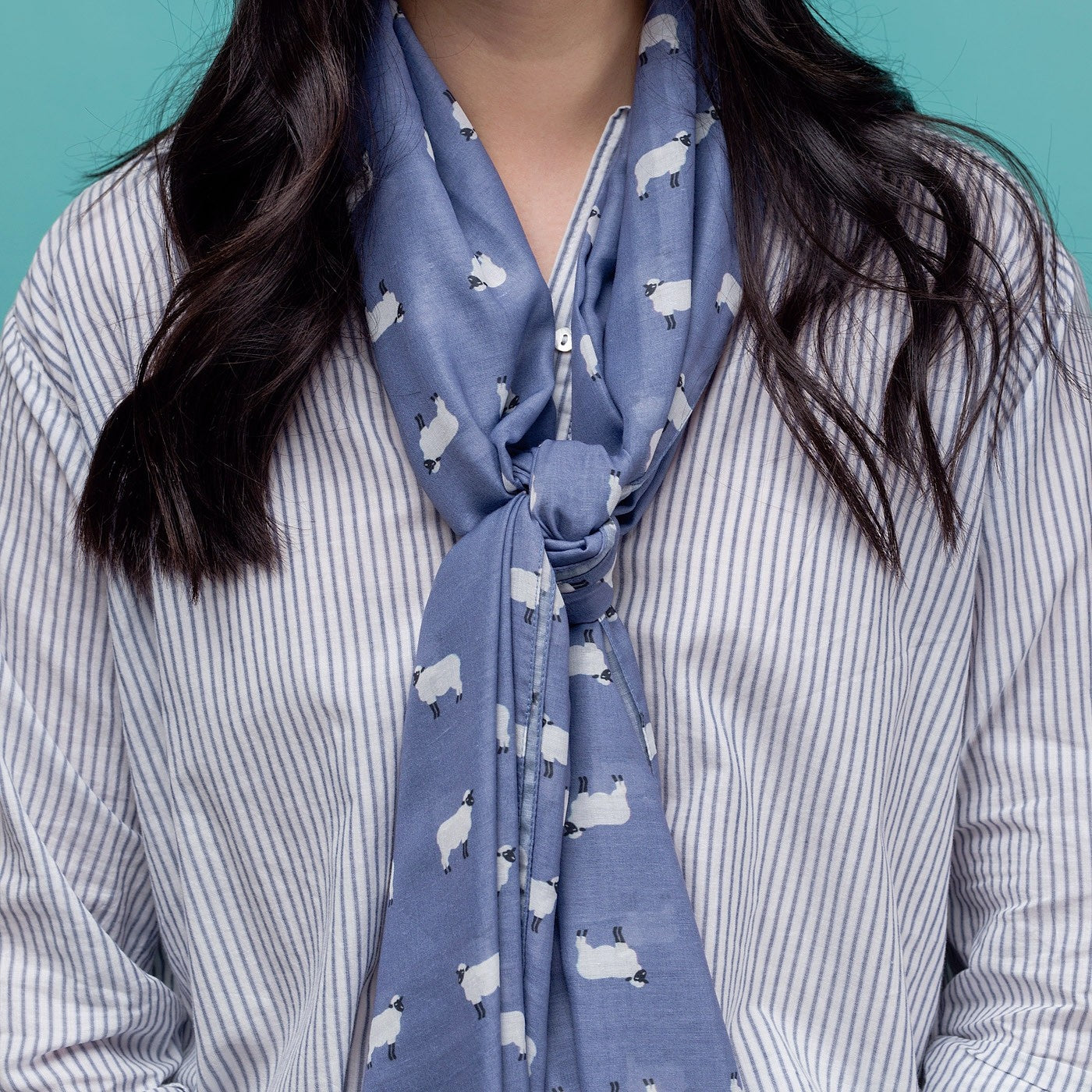 Lilac sheep print scarf, finished with a rolled edge.