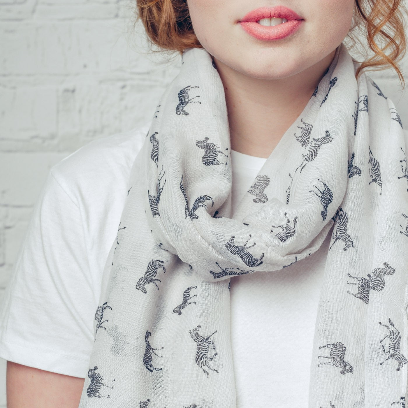 Zebra print on a white background with rolled and tassel edging