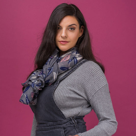 Pretty vintage leaf print scarf on a solid grey coloured background and finished with a rolled edge
