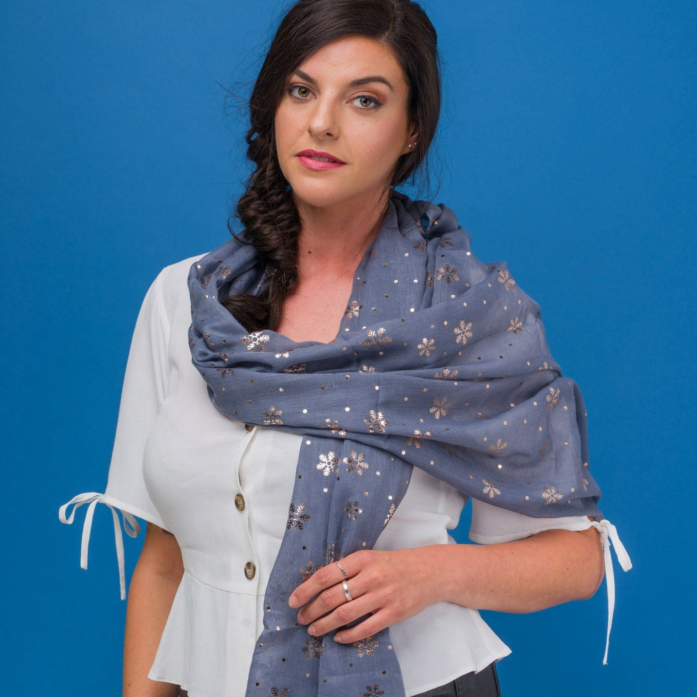 Delicate snowflake foil print grey scarf, finished with a rolled edge.