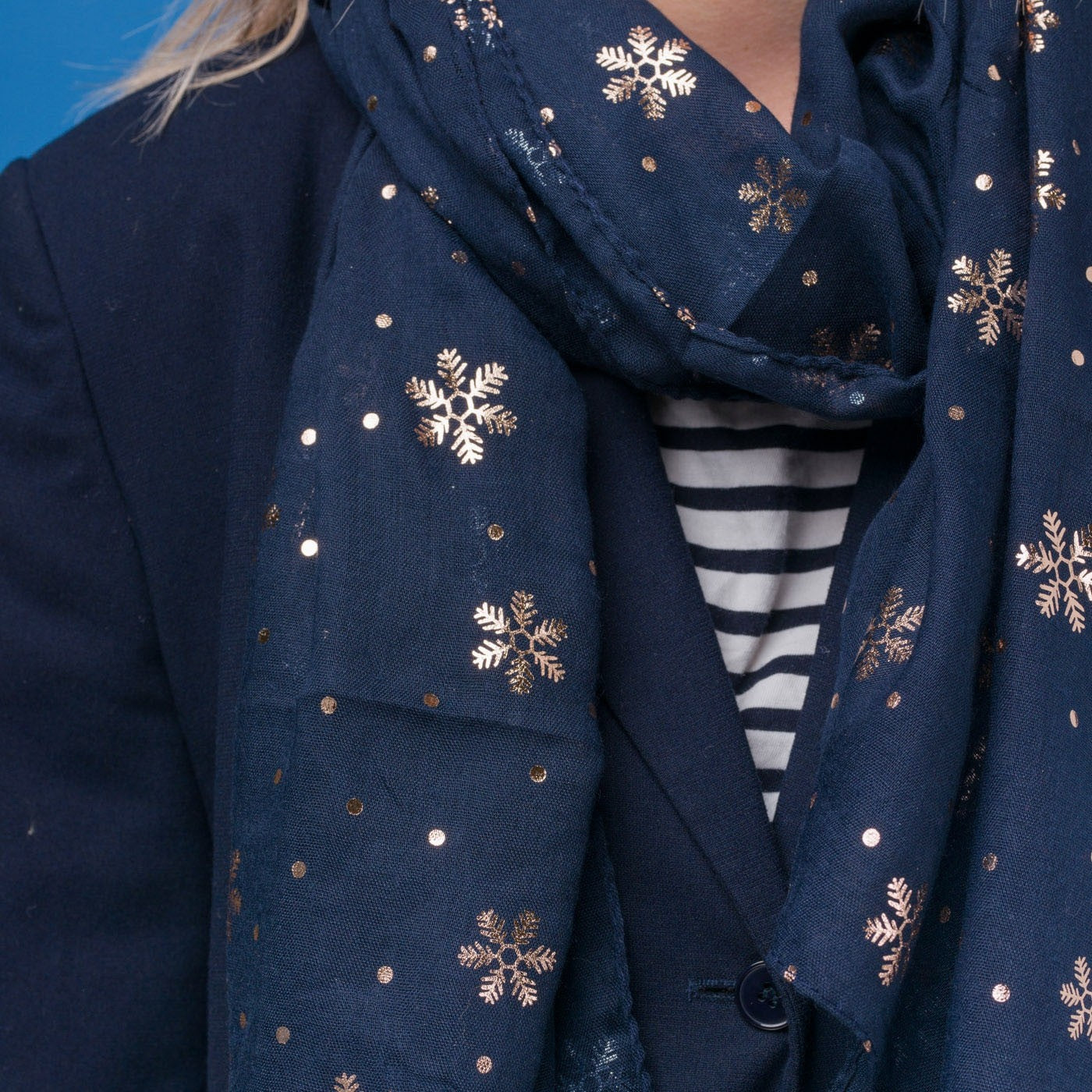 Delicate snowflake foil print navy blue scarf, finished with a rolled edge.